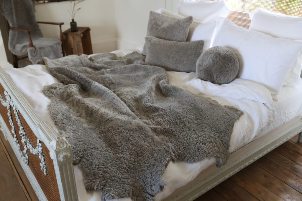 Sheepskin Throw Swedish Mole with statement toning cushions various sizes