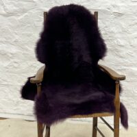 Sheepskin Rug British Luxe Purple by Owen Barry on Chair
