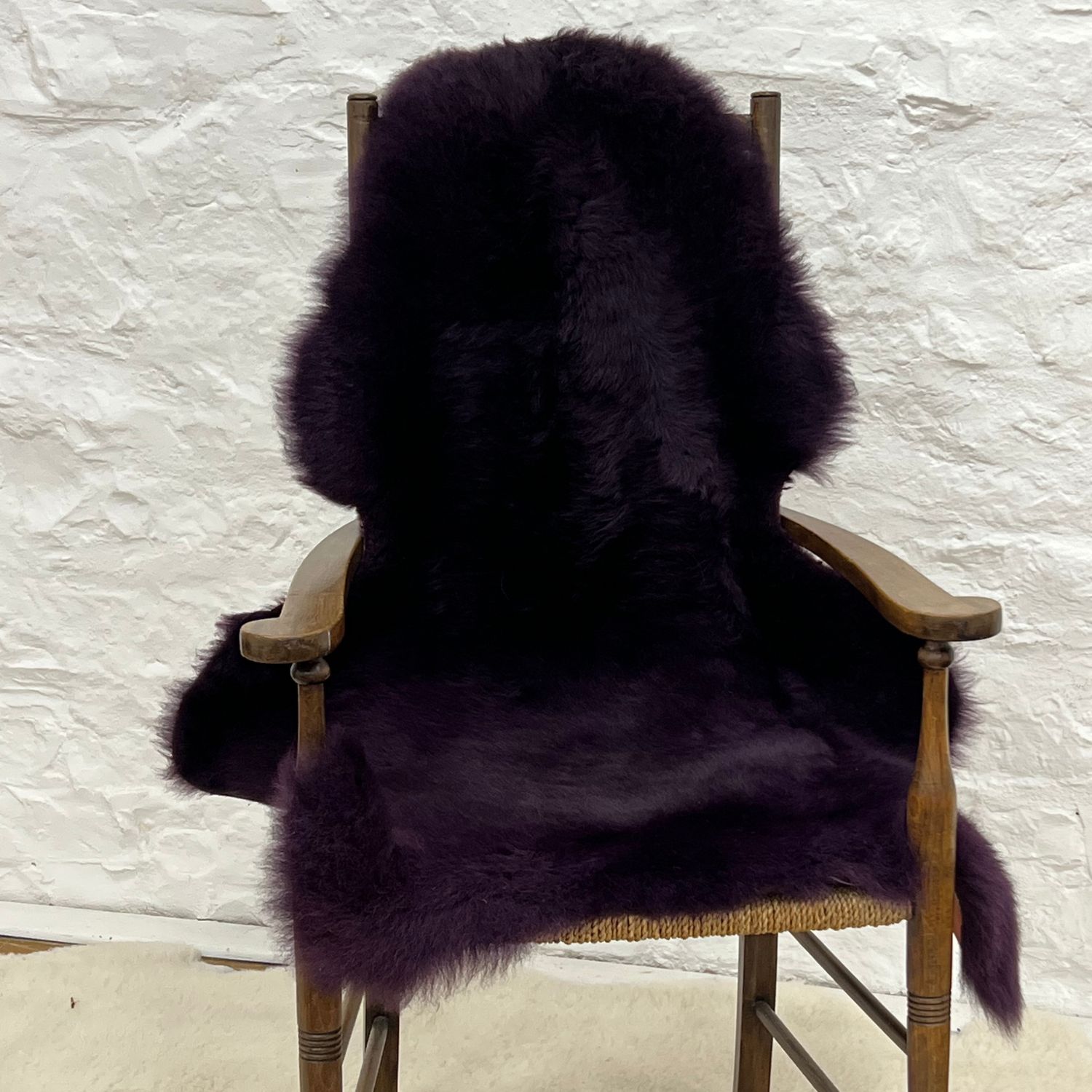 Sheepskin Rug British Luxe Purple by Owen Barry on Chair
