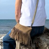 Fistral Oatmeal Suede Fringe crossbody by Owen Barry